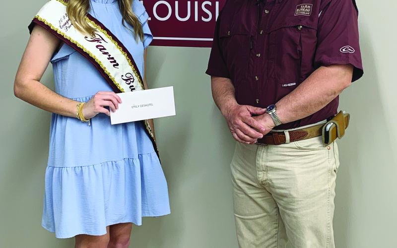 NEW QUEEN CROWNED - During the March board meeting of the Evangeline Parish Farm Bureau held March 14, Emily Deshotel was crowned as the 2022 Evangeline Parish Farm Bureau Queen. She is shown with Farm Bureau President David Scott “Scotty” Fontenot. (Photo courtesy of Kristie Mayeux)