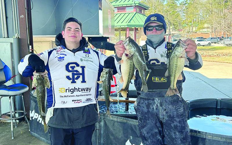 Nixon Doucet (left) and Brecken Figueiredo (right) show off their fish they caught while competing in the LHSAA Bass Fishing Region I tournament at Toledo Bend. The two Sacred Heart anglers qualified for the state tournament. Also qualifying for state were Austin West and Jake Ardoin. (Photo courtesy of Kris Aguillard)