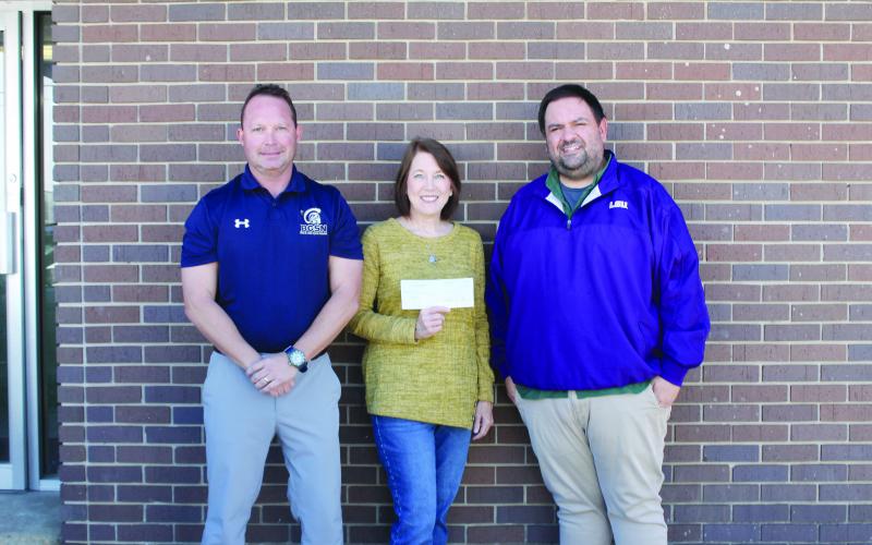 Pictured from left are Lance Chapman, chief financial officer of The Evangeline Bank and Trust Company; Claudia Ortego; and Tony Marks, editor of the Ville Platte Gazette. Not pictured are Garland Forman and Richard Guillory. (Gazette photo by Kathy Longino)