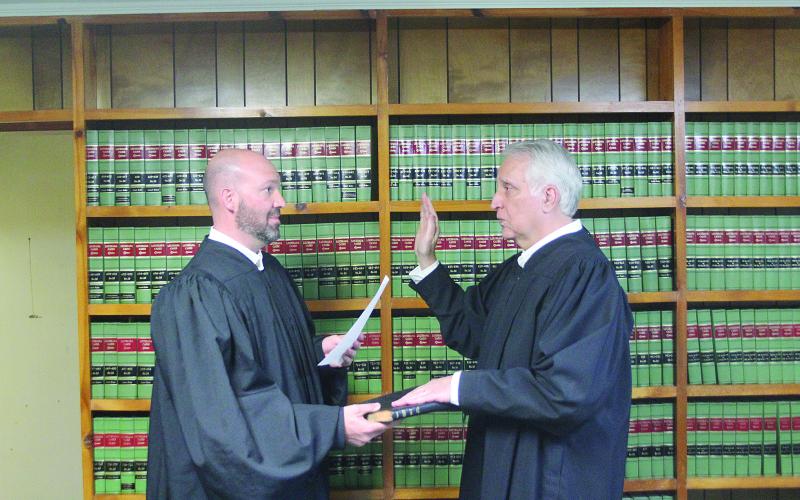 TAKING the OATH – Ville Platte City Judge Greg Vidrine gives the oath of office to newly elected Appellate Judge Gary Ortego of Ville Platte. (LSN photo by Tony Marks)