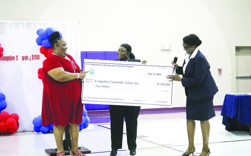 Executive Director of Evangeline Community Action Agency , Inc., Carleen Bellard (left) accepts a $1 million grant from HUD Office of Lead and Hazard Control and Healthy Homes Dr. Taneka Blue, and HUD New Orleans field office director Sylvia Purvis (right). (Gazette photo by Tony Marks)