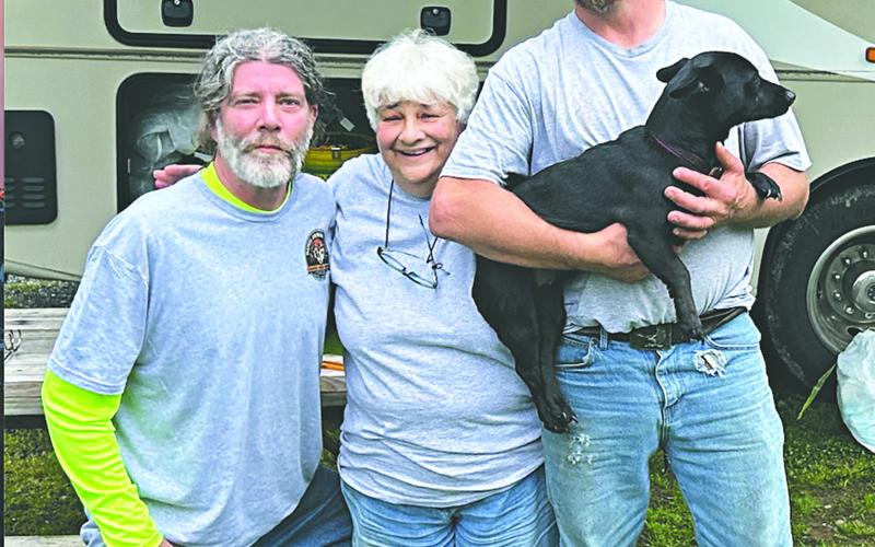 From left, in the left photo, volunteer drivers Paul LeJeune (left) and James Moran (right), along with Gretta Ardoin (center) played a vital role in escorting the dogs on the long drive up to Pennsylvania.