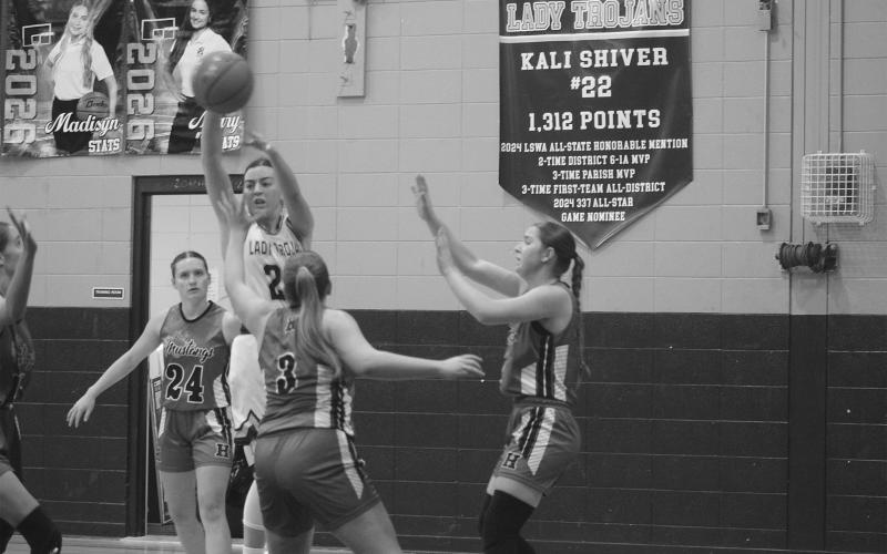 Bre Ardoin (24) looks to pass the ball to a Sacred Heart teammate in a 42-41 loss to Hackberry on Tuesday night. (Gazette photo by Tony Marks)