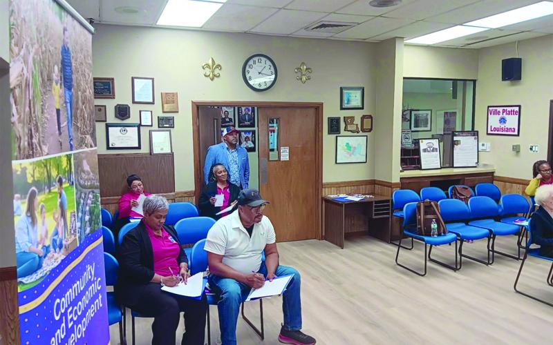 Participants, including Ville Platte Mayor Ryan LeDay Williams (center), listen to a presentation during a recent heirs’ property training event in Ville Platte. (Photo provided by the Southern University Ag Center)