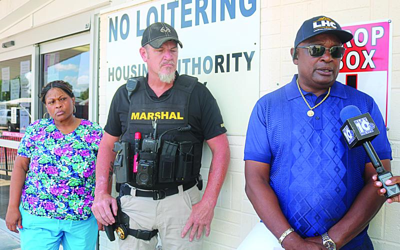 Arthur Sampson (right), chairman of the Ville Platte Housing Authority board, speaks during a press conference held Tuesday, July 9. Also pictured are Ville Platte Chief Deputy City Marshal Nik Cormier (center) and board member Lena Charles (left), who represents the tenants. (Gazette photo by Tony Marks)