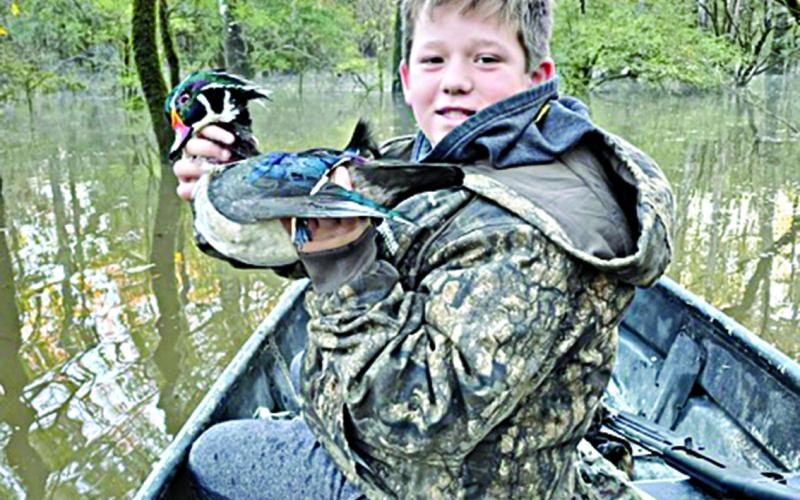 (Right photo) Walker Guillory proudly shows off a duck. (Photos courtesy of Chris Guillory)