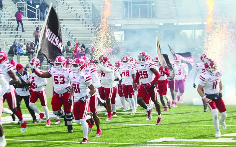 The Ragin Cajuns of the University of Louisiana Lafayette take the field in Shreveport before clashing against the University of Houston Cougars in a 23-16 loss in the Radiance Technologies Independence Bowl. (LSN photo by Tony Marks)