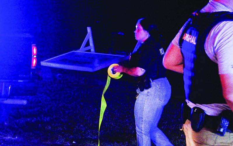 An officer with the Ville Platte Police Department ropes off the scene on W. Beauregard Street near the intersection of NW Railroad Avenue. (Gazette photos by Tony Marks)