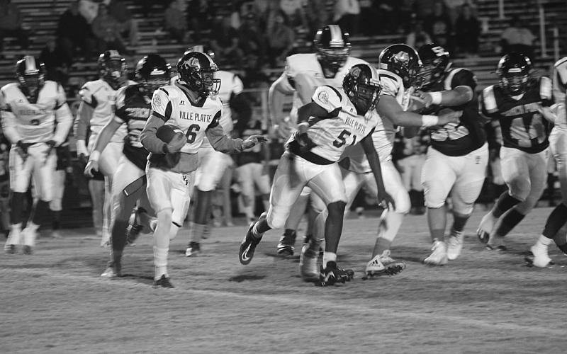 Ville Platte running back Jakahalen Slaughter (6) looks to turn the corner for a running lane during the first half of the Bulldogs road loss in District 4-3A. (Gazette photo by Rhett Manuel)