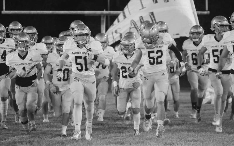 The Sacred Heart Trojans will take the field tomorrow night in the first round of the Select Division IV playoffs against Covenant Christian. The team is seeking its second playoff win since 2013 and first since a win over St. Edmund last season. (Gazette photo by Rhett Manuel)