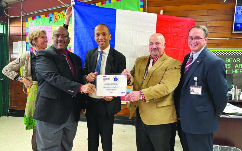 In the left photo (from left) are Evangeline Parish Superintendent Darwan Lazard, Rodolphe Sambou (Consul General of the French Republic in New Orleans), Mamou Elementary Principal Troy Fontenot, and Evangeline Parish Assistant Superintendent Mike Lombas.
