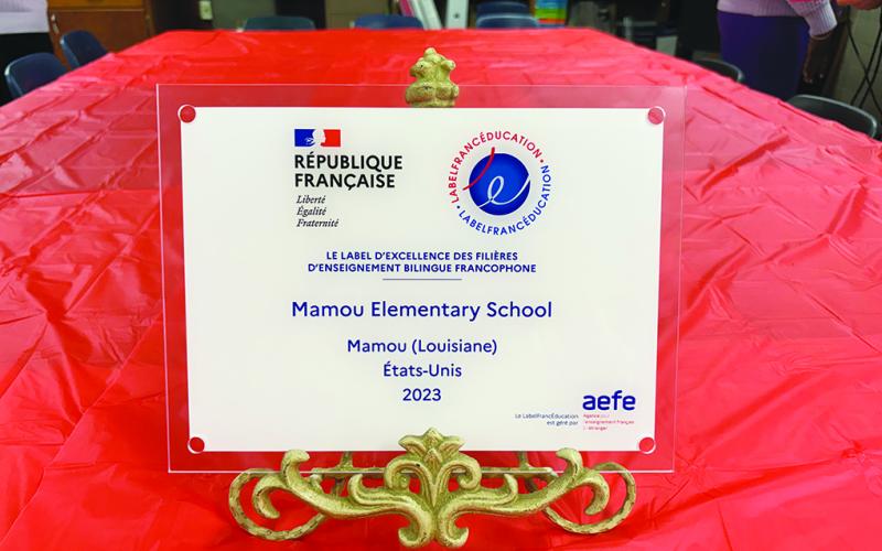 In the right photo is a close up of the special award presented to Mamou Elementary’s French Immersion program. (Gazette photos by Heather Bogard)