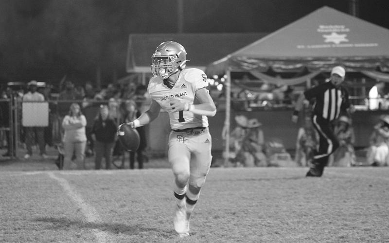 Hayden Droddy (7) eyes a target in the game against Opelousas Catholic last week. Droddy and the rest of the Trojans ended the regular season with a win against North Central on homecoming night and will learn their postseason fate today when the brackets are revealed. (Gazette photo by Rhett Manuel)