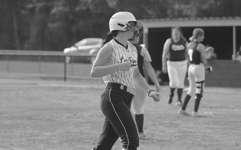 Jenna Estilette (3) is among the Sacred Heart Lady Trojans representing their squad on the All-District team in 5-1A. Estilette is pictured here as she circles the bases after hitting a home run in a game against Westgate earlier this season.  (Gazette photo by Tony Marks)