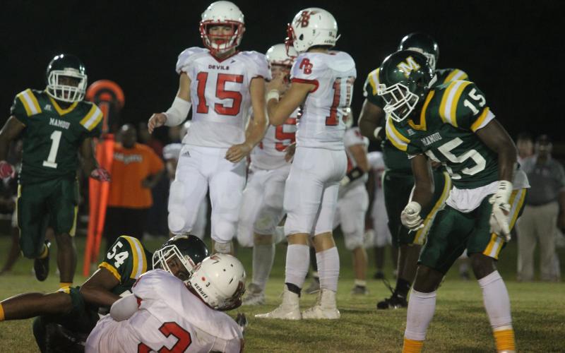 Mamou’s Keyshawn Guillory (54) wraps up a tackle against a Port Barre Red Devil earlier this season. (Gazette photo by Tony Marks)