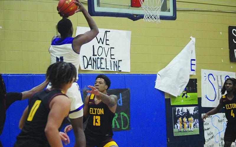 Ville Platte’s Montavis Seraille (4) goes up for a basket in the Bulldogs’ game against Elton during the Turkey Tournament at Sacred Heart. (Gazette photo by Rhett Manuel)