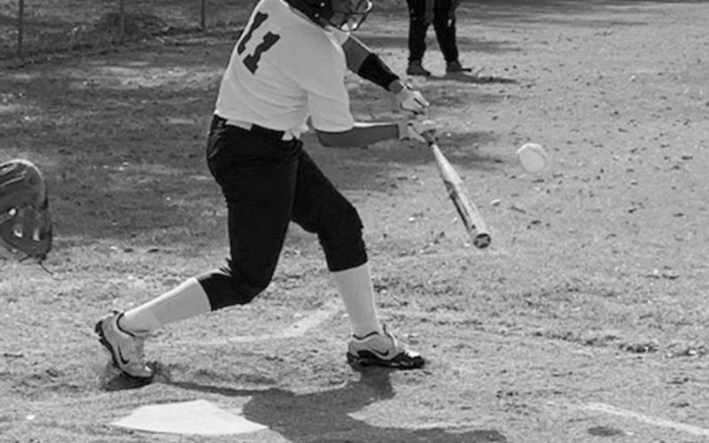 Kenzie Stevens (11) takes a swing at the plate in recent action for her Ville Platte Lady Bulldog softball team. (Gazette photo by Rhett Manuel)