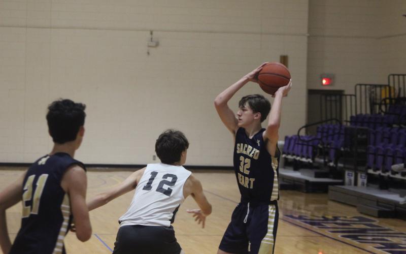 A Sacred Heart player focuses on making the right pass within the flow of the Trojans’ offense. Learning to be a better teammate and a better understanding of the Sacred Heart system have been goals set in the summer season.(Gazette photo by Rhett Manuel)