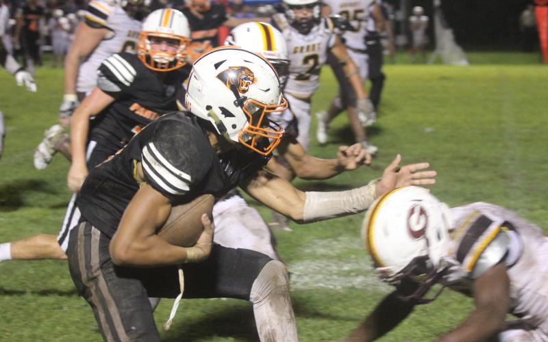 Pine Prairie’s Bryce Ardoin fights for extra yardage on a completion from Branson Fontenot  (Gazette photo by Tony Marks)