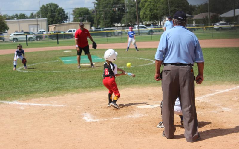 Ville Platte Red Hots player Leah Stevens puts the bat on the ball during Saturday’s Pony Coach Pitch Sectional tournament in Kaplan. The Red Hots won their opening game against Youngsville. (Gazette photo by Rhett Manuel)
