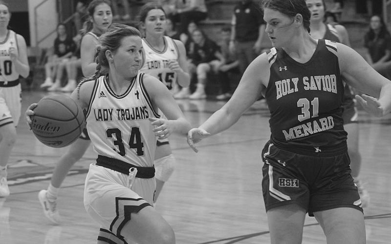 Taylor Darbonne (34) surges past a Holy Savior Menard defender on her way to the goal this past Monday night. (Gazette photo by Rhett Manuel)