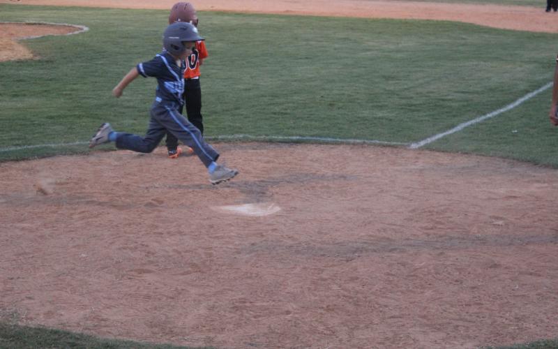 Graham Fontenot (4) scores a run for the Ville Platte West All-Stars against Pine Prairie North. (Gazette photo by Rhett Manuel)