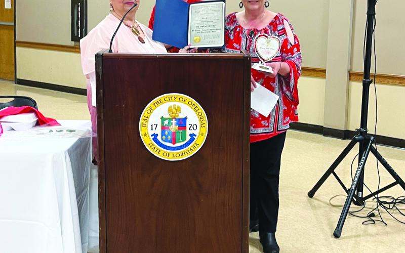 WOMEN WITH HEART PRESENTED - Dr. Gwen Fontenot was the recipient of the Evangeline Parish Women with Heart Award. Shown, from left, are St. Landry-Evangeline United Way executive director Ginger LeCompte, Suzy Lemoine and Connie Lamke, who accepted the award on Fontenot’s behalf.(Gazette photo by Heather Bogard)