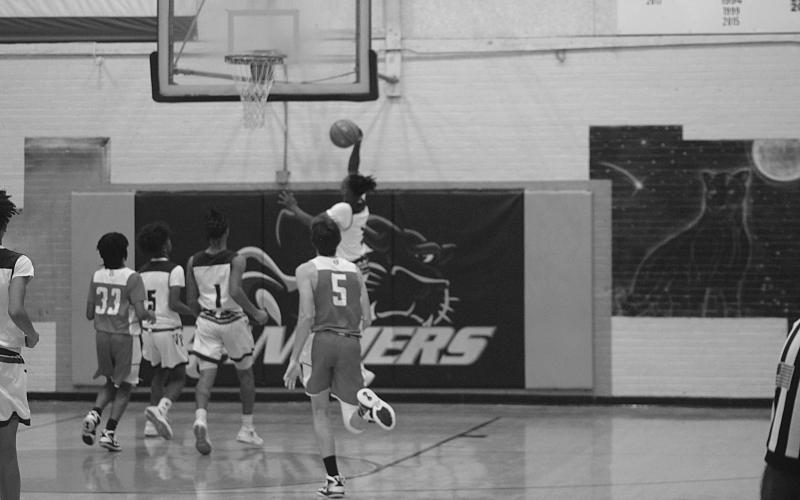 Latelldrick Prejean (3) gains elevation as he looks for points against Basile for the Ville Platte Bulldogs in the parish tournament. (Gazette photo by Rhett Manuel)