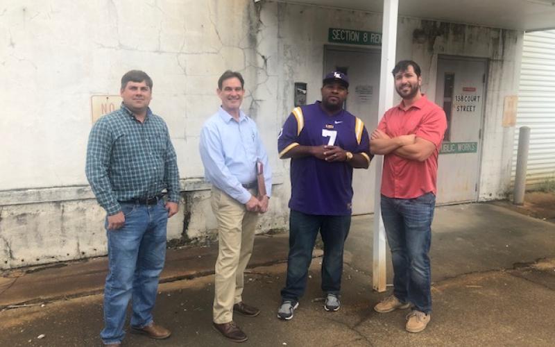 Pictured from left are Eric Grimmett, Secretary-Treasurer Donald Bergeron, Police Jury President Ryan Williams, and Ryan Meche as they tour a police jury owned building that will receive a facelift and  will be renovated. This particular building, located in the courthouse square, will serve as an LUSFiber servicing center for the people of the parish. (Gazette photo by Tony Marks)
