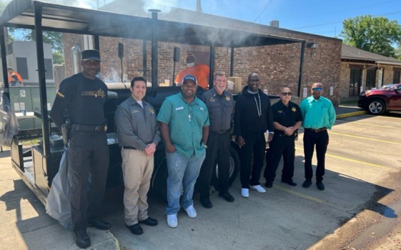 From left are Evangeline Parish Sheriff Deputies George Washington Goldman and Chase Melancon, Evangeline Parish Police Jury Vice President Ryan “LeDay” Williams, Lieutenant Scott Clarkson, Reginald Watts, Assistant Warden and First Lieutenant Barry Giglio, and Tapas Sarma of James2Ministry. (Gazette photo by Tony Marks)
