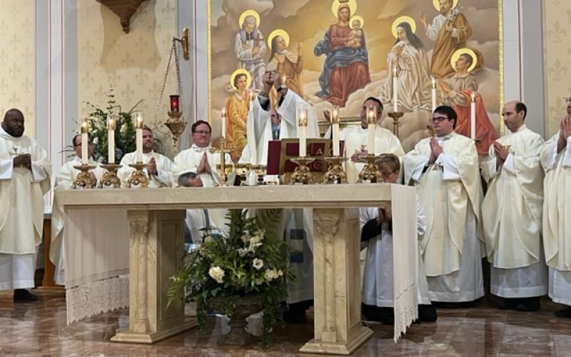 While being flanked by brother priests from the Diocese of Lafayette, Fr. Mitch Guidry elevates the Blessed Sacrament during his 25th Anniversary Mass of being a priest. The Mass was on the patronal feast day of Our Lady, Queen of All Saints, on Monday, August 22. Among the priests present were those currently and formerly assigned to churches in Evangeline Parish and those who are native sons of Evangeline Parish. (Gazette photos by Tony Marks)