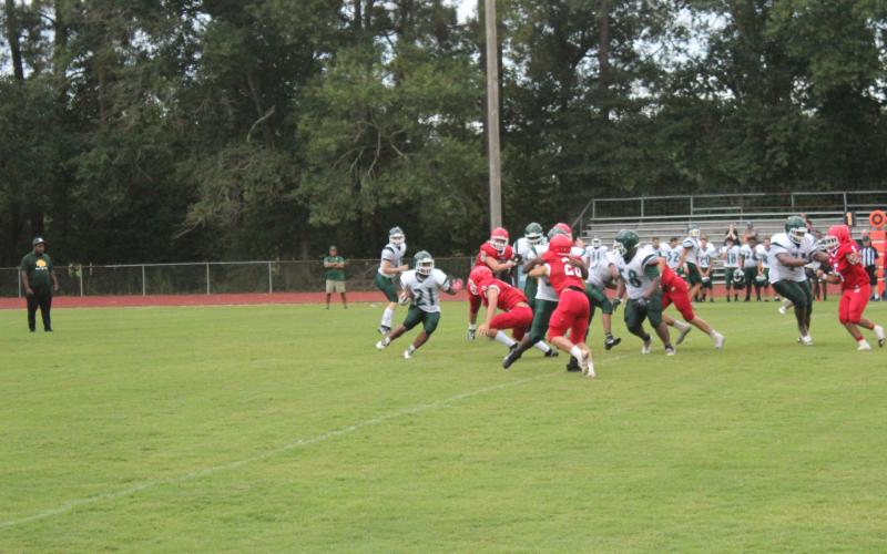 Mamou’s Keontez Campbell (21) tries to find a running lane against a stingy Basile defense in the teams’ scrimmage held Thursday, August 18. (Gazette photo by Rhett Manuel)