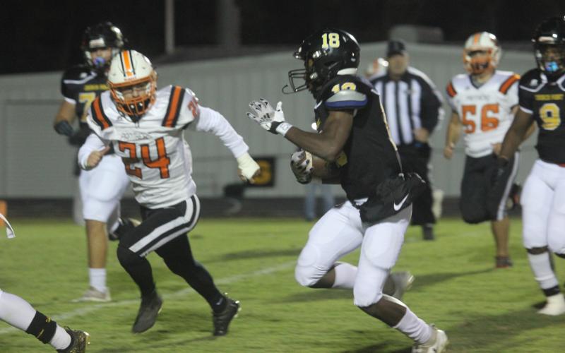 Pine Prairie’s Laine Elliott (24) tries to keep pace with Church Point’s Tylon Citizen (18) in the Panthers’ 64-0 road loss. (Gazette photo by Tony Marks)
