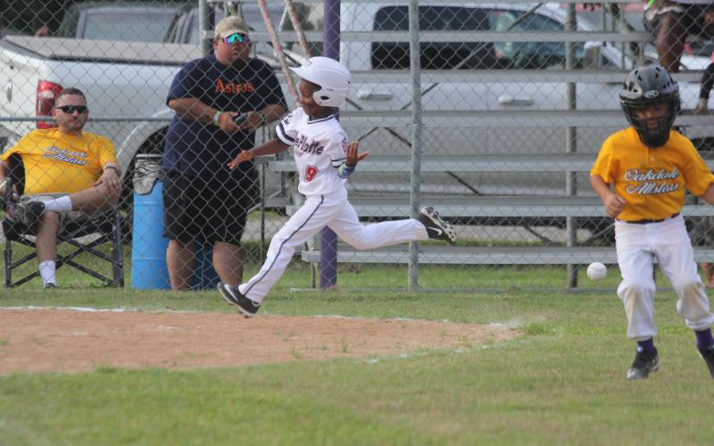Amari Carr (9) trots around the bases and approaches home plate after hitting a home run in Ville Platte East’s 21-5 win over Oakdale to begin the East Sub-District Tournament. Carr and the rest of the T-Ball All-Stars from Ville Platte will now compete in the Dixie Youth District 7 Tournament here in Ville Platte beginning Thursday, June 23. (Gazette photo by Tony Marks)
