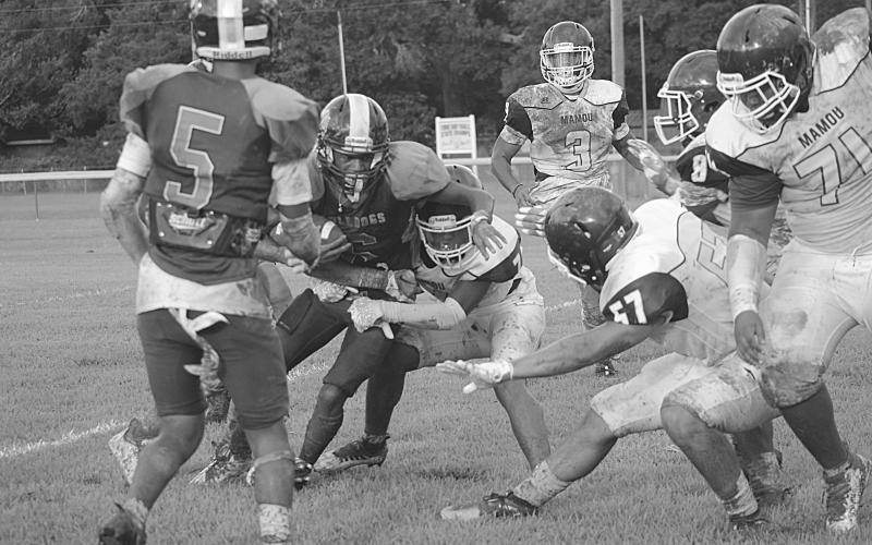 Jakahalan Slaughter (6) stays on his feet after meeting up with Mamou’s defensive unit in the jamboree. Slaughter and the rest of his Ville Platte High Bulldogs now look to defend their Tee Cotton Bowl title. (Gazette photo by Sylis Manuel)