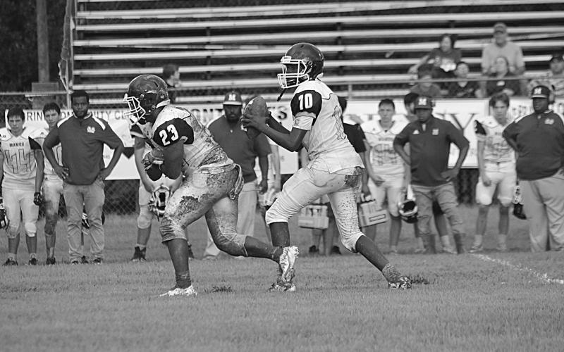 Mamou quarterback Dezmond Skinner (10) drops back for a pass in the jamboree. He threw for 189 yards and 3 touchdowns in the Green Demons’ 32-22 win over E. Beauregard  (Gazette photo by Sylis Manuel)