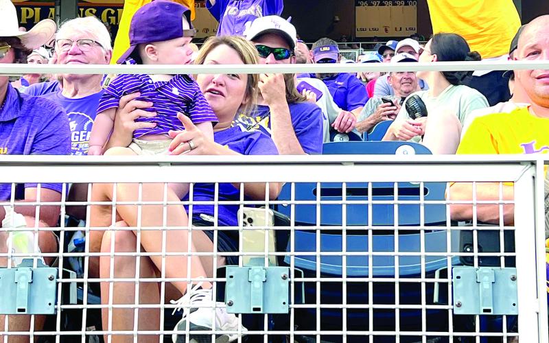 This picture of local fan Anita Haywood holding up a K sign at the College World Series earned Ville Platte Gazette editor Tony Marks a third place award in College-Pro Photography - Open Class at this year’s Louisiana Sports Writers Association Awards Luncheon.