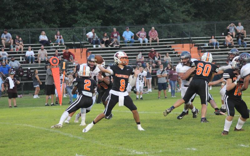 Branson Fontenot (8) delivers a pass in Pine Prairie’s 49-16 win over Merryville earlier this season. The Panther quarterback went 12 for 15 with 312 yards and five touchdowns in the team’s first win in two seasons and went on to be named as a member of the All-District first team. (Gazette photo by Rhett Manuel)