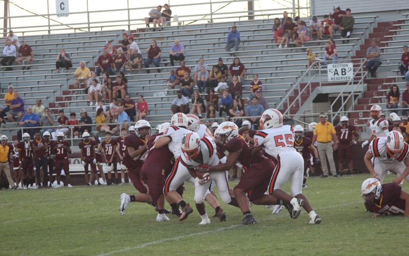 Elijah George (2) muscles his way forward for some of his 364 rushing yards against Elton. He ran 32 times and scored five touchdowns on the night. (Gazette photo by Rhett Manuel)