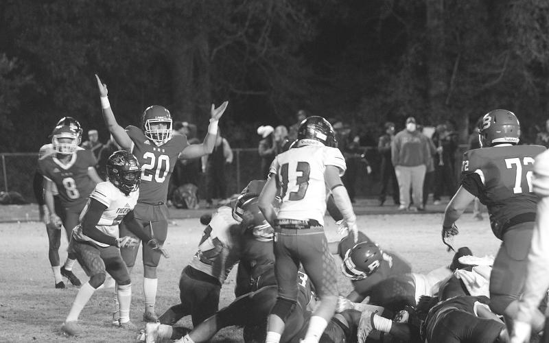 Basile’s Justin Smith (20) celebrates as Ethan Bazinet crosses the goal line for a touchdown in the Bearcats’ season ending loss to Logansport in the quarterfinals. (Gazette photo by Tony Marks)