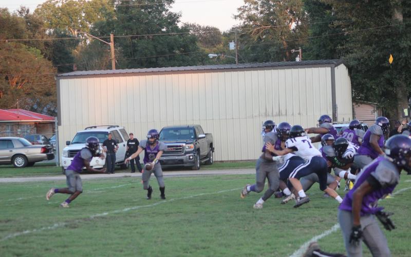 Ja’Keelan Bruno (2) takes a handoff from quarterback Michael Berry in a Ville Platte High football game played earlier this season. The Bulldogs now host Mamou in the first district contest for both squads. (Gazette photo by Rhett Manuel)
