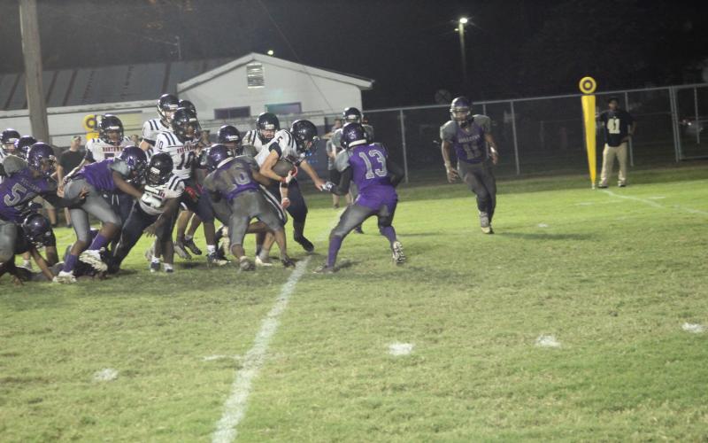 The Ville Platte defense led by Jakailon Fontenot (16) and Brandon Freeman (13) attempt a goal line stop as the Bulldogs hosted Northwood-Lena in their first action of the season. (Gazette photo by Rhett Manuel)