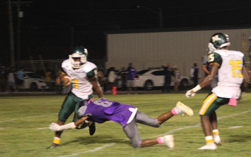 Jakhalan Slaughter (6) of the Ville Platte High Bulldogs lays out for a tackle on Mamou’s Jerez Edwards (7) in the district opening contest for both teams. (Gazette photo by Rhett Manuel)