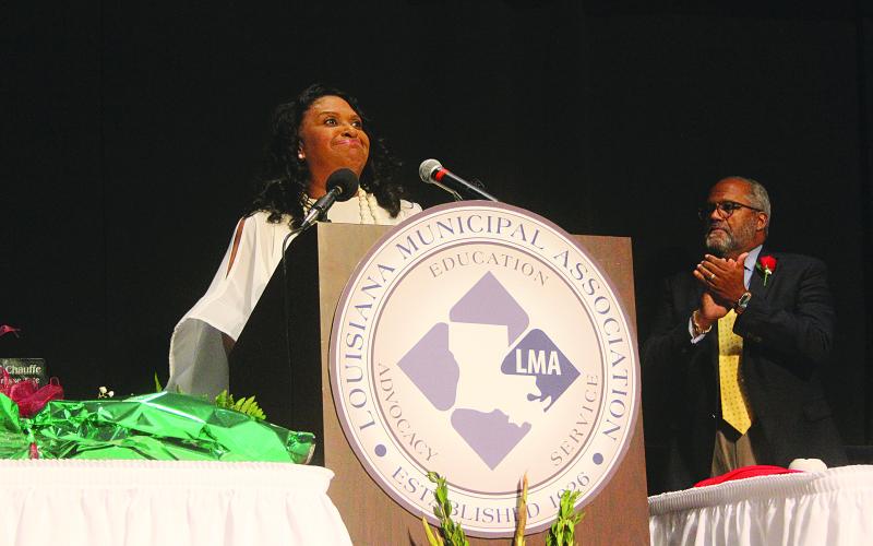 Ville Platte Mayor Jennifer Vidrine (left) delivers her remarks after being installed as the first black president of Louisiana Municipal Association. Also pictured is U.S. Congressman Troy Carter, the lone African-American and Democrat in the Louisiana congressional delegation. Gazette photo by Tony Marks