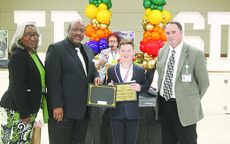 L-R: Mamou Junior High Principal Lisa Celestine, Superintendent Darwan Lazard, 5th Grade Student of the Year Emmett Christ, and Assistant Superintendent Michael Lombas. (Gazette photo by Tony Marks)