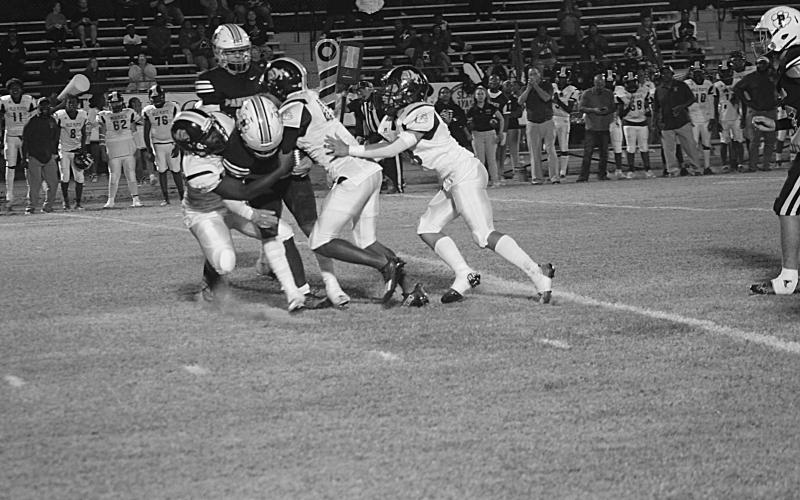 Several Ville Platte defensive players combine to make a stop against Pine Prairie in their matchup last season. (Gazette photo by Rhett Manuel)