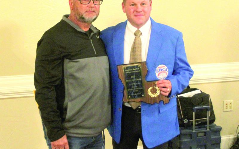 Kenney Courville (right) was inducted into the Louisiana Baseball Coaches Association Hall of Fame on Friday, January 13. Courville was introduced by current Kinder baseball coach Rick Whittington (left). (LSN photo by Tony Marks)