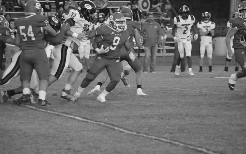 Basile’s Horace Edwards (9) finds real estate to gain in a game earlier this season against Gueydan. (Gazette photo by Rhett Manuel)