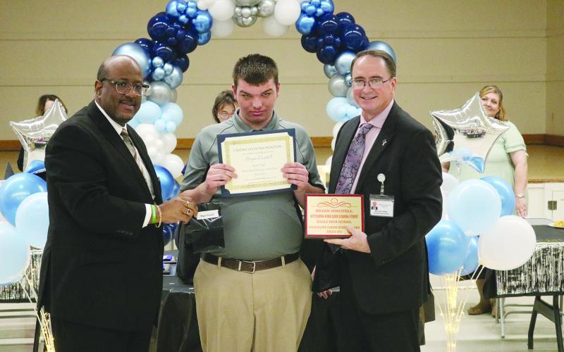 From left are Superintendent Lazard, work-based learning student of the year Bryan Disotell, and Assistant Superintendent Lombas.