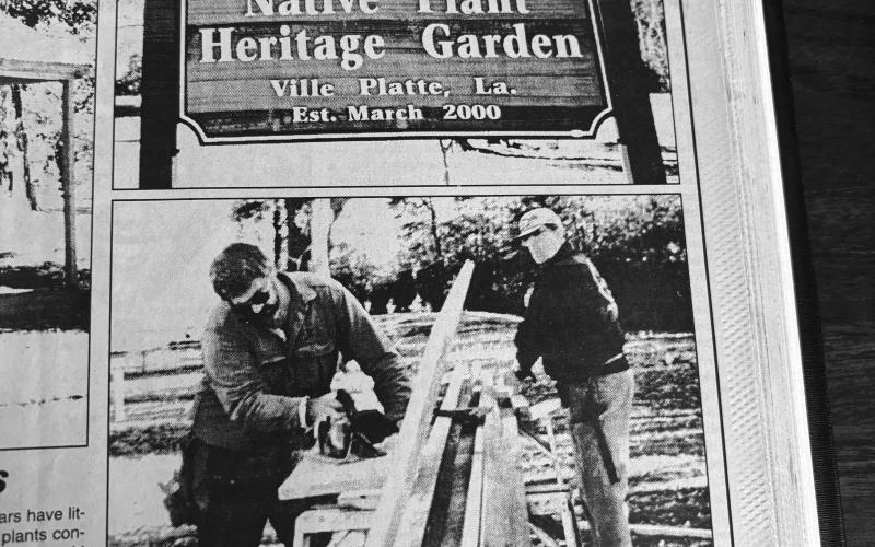 New signage was installed at the native Plant Heritage Garden (shown on top) in December 2000, along with an Acadian architecture-style storage shed. The shed was constructed by groundskeepers Bob Gassman, Donald Reinert and Billy Rose (shown being worked on in the bottom photo).  (Gazette archive photos)